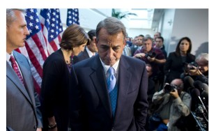 Speaker of the House Rep. John Boehner, R-Ohio, walks away from the microphone during a news conference after a House GOP meeting on Capitol Hill on Tuesday, Oct. 15, 2013 in Washington. The federal government remains partially shut down and faces a first-ever default between Oct. 17 and the end of the month. (AP Photo/ Evan Vucci)